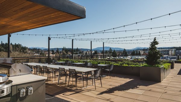 Enjoy views of Mount Rainier from the rooftop of the apartment homes at Modera Redmond while you BBQ or lounge with friends and family