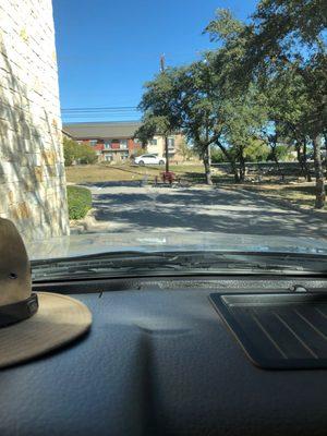 In drive thru looking at outside sitting area