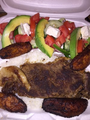 Steak and rice platter with plantains and salad