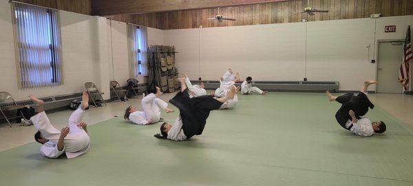 Ukemi practice, back rolls at Tenchi Aikido