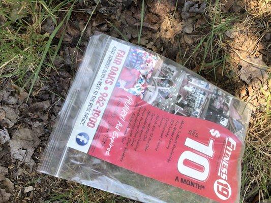 Trash from fitness 19 that ends up all over our neighborhood. What a fantastic "promotion".