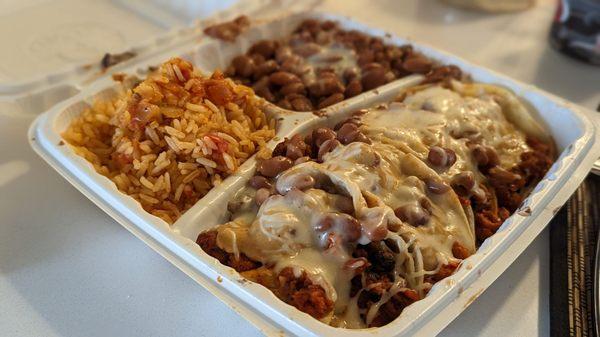 Tacos Combination 'plate,' with cheese and chipotle sauce as toppings over their veggie pastor.