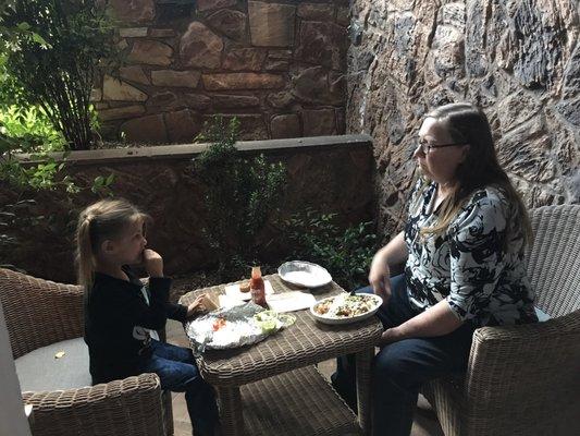 Nanny Joyce and our daughter enjoying dinner on our hotel patio before their nature walk.