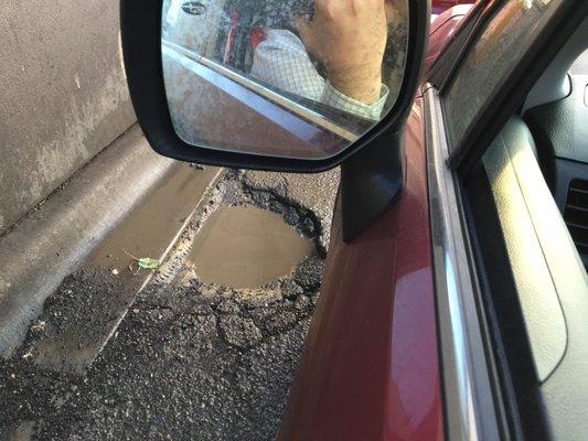 Mini sink hole in their drive thru.    That's ok.  I'll take a flat tire with my mocha.