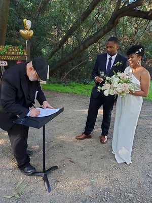 Russ signing our marriage license.