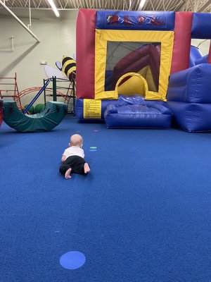 Crawling to the bounce house as fast as he could to go down that slide!! So fun