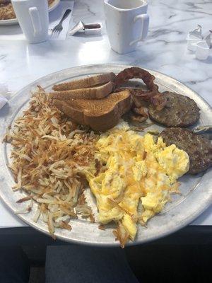 Eggs. Sausage, hash browns, toast and bacon.