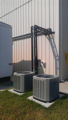 New Trane commercial condensers and custom angle iron copper line rack over walkway