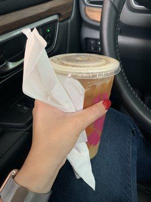 They hand you your iced coffee with a straw wrapped in napkins - so thoughtful and appreciated