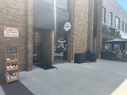 Front door of shelflife bookstore it's right next to Asterix coffee place and the magna wine boutique.