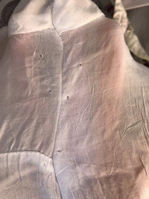 I picked up a dress and it is full of pin holes on both sides top to bottom. No remedy was offered. Disgusted