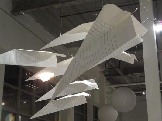 Giant notebook paper airplanes.