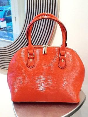 We offer a large selection of designer handbags at affordable prices