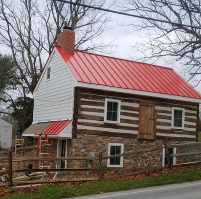 "Bright Red" Standing Seam Metal Roofing on a historical cottage located in Landenberg, Pennsylvania.