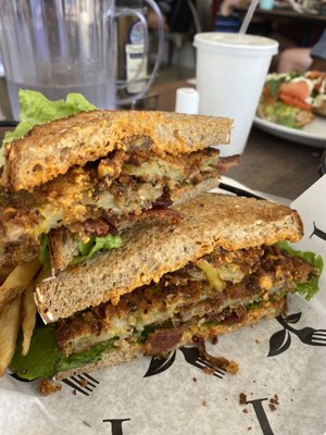 Fried green tomato sandwich with smoked bacon and pimento cheese