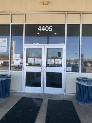 Entry door into clinic. They have VIRTUAL WAITING ROOMS. Call first