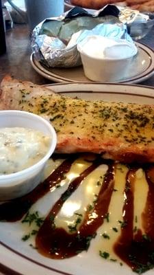 Broiled cod with a baked potato.