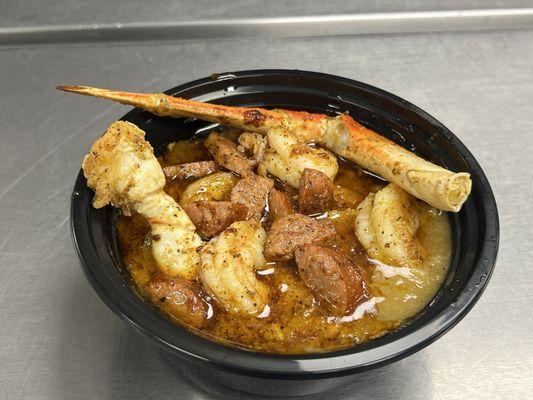 Seafood Gumbo with dungeness crab legs, shrimp and andouille pork sausage served over white rice.