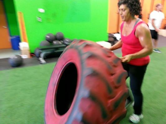 Tire flips at Ultimate Fit Zone's cross training boot camp