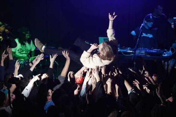 Asher Roth at a Trending Event crowd surfing.