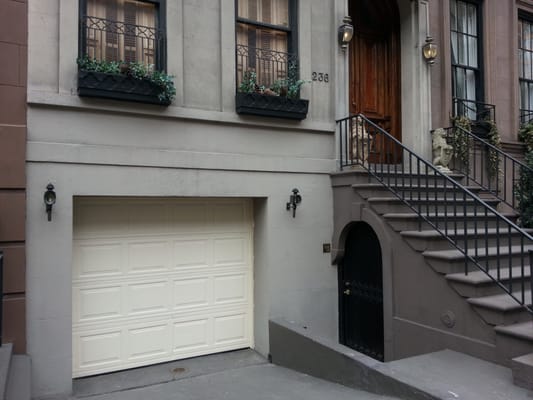 New York City garage door installation, almond color, fully insulated