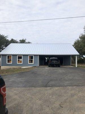 Metal roof installed on garage and workshop