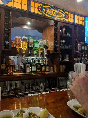 Behind the bar - nice glass, lighting, and set-up.