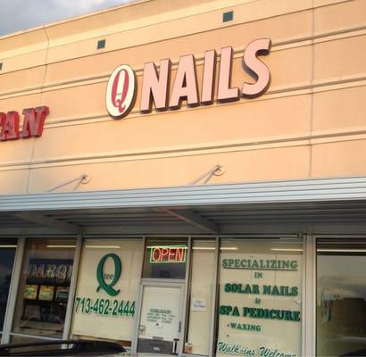 Sign above the store reads like Q Nails.