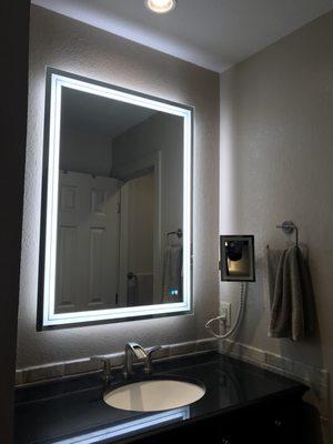 Alan electric removed the old fixture, rewired for this new lighted mirror, installed and wired new can light and additional power outlets.