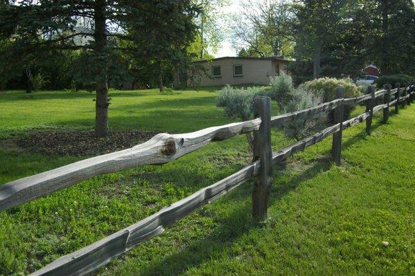 A rustic cabin / vacation home in the city with room to roam! Feels like country living on almost 1/2 acre on this  sprawling corner lot