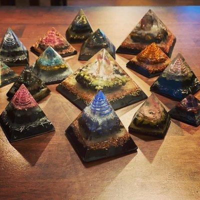 A great selection of Orgonite products available.  Pictured here is a selection of our pyramids.  Made in Michigan.