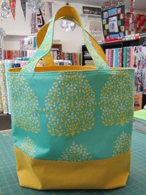 Super cute fabrics from Amy Butler and an easy fun pattern and you can make this!