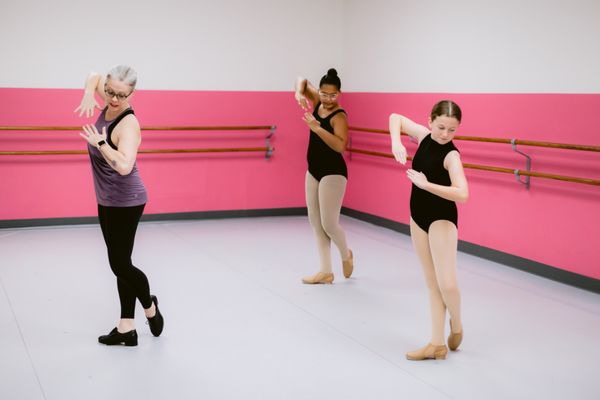 Tap dancers with instructor