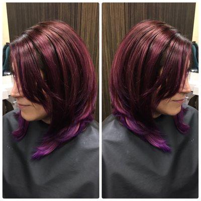 Purple hair with a medium swing Bob style.