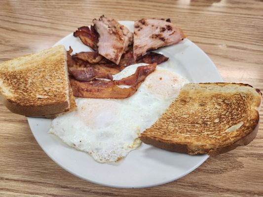 2 over easy, bacon, ham, sourdough toast