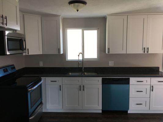 Shaker White Cabinets and Desert Pine Laminate