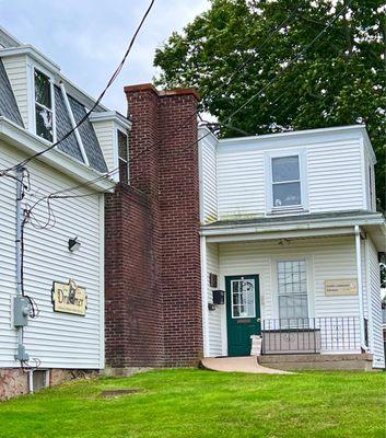 On the left - in same building as Granby community tv