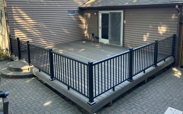 Fortress Apex brand PVC decking with Timbertech "Impression Rail Express" aluminum railing system.