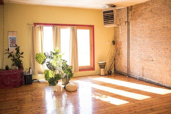 Big windows fill the second floor studio with natural light