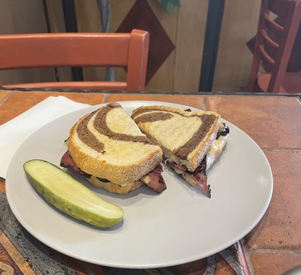 The Reuben Sandwich.  All great sandwiches come with a pickle!