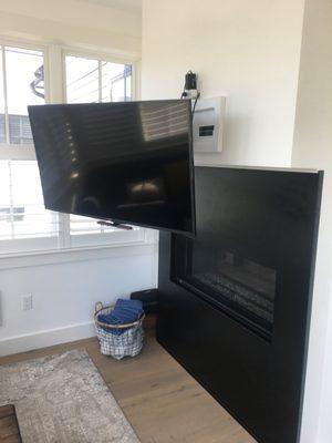 Adjustable TV mount above Fireplace