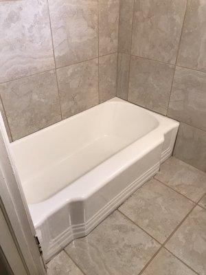 After refinishing cast-iron tub in white.