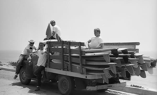 me at 17 sitting atop bunch of state of the art Surfboards Hawaii boards moving to new location 1962