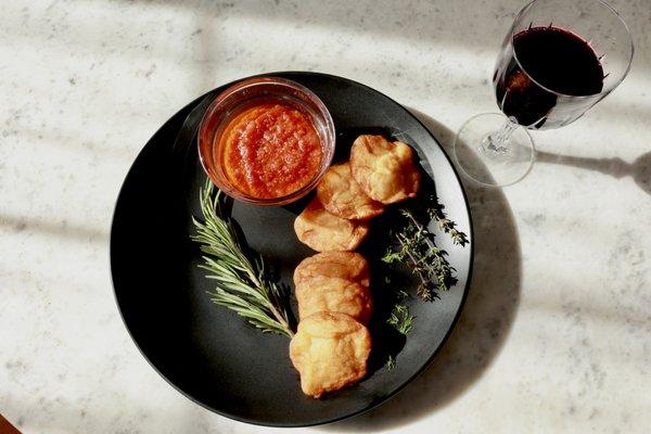 Bean cake with tomato and onion sauce and hibiscus drink