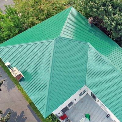 Beautiful green metal roof, expertly installed by Premier Roofing.