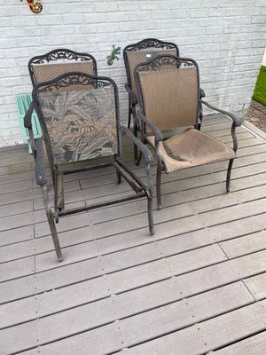 Four sling chairs in need of repair. They have replaced one chair back. Still waiting.