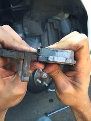 Left side: the "50% or better" brake pads - right side: new out of the box.