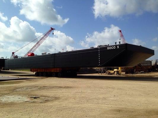 New tank barge being rolled out to a drydock.