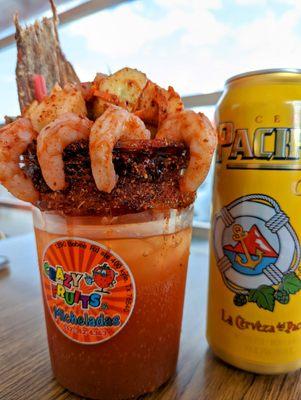 Michelada La Mixta: shrimp, jerky, jicama, cucumber, jerky, chamoy, tajin, valentinas hot sauce. Full meal & beer in a tub, yo