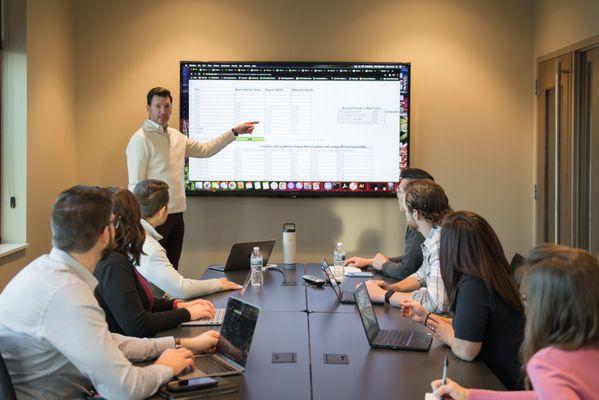 Give presentations easily using the large TV monitor in our conference room